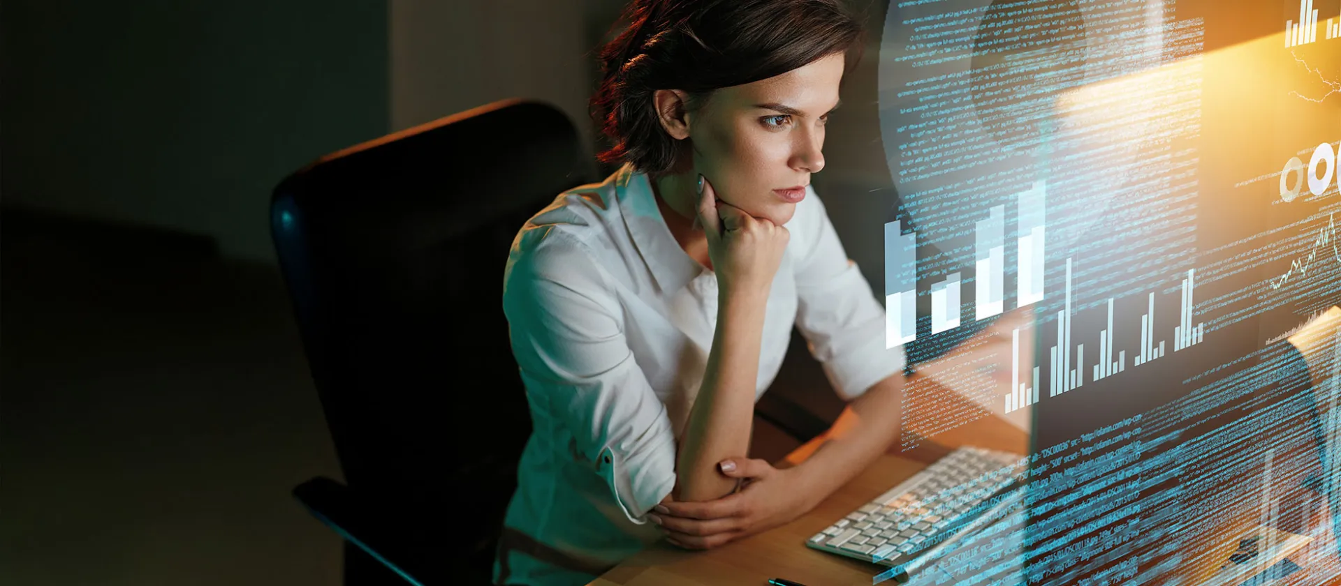 Woman analyzing big data visualizations on a futuristic screen.