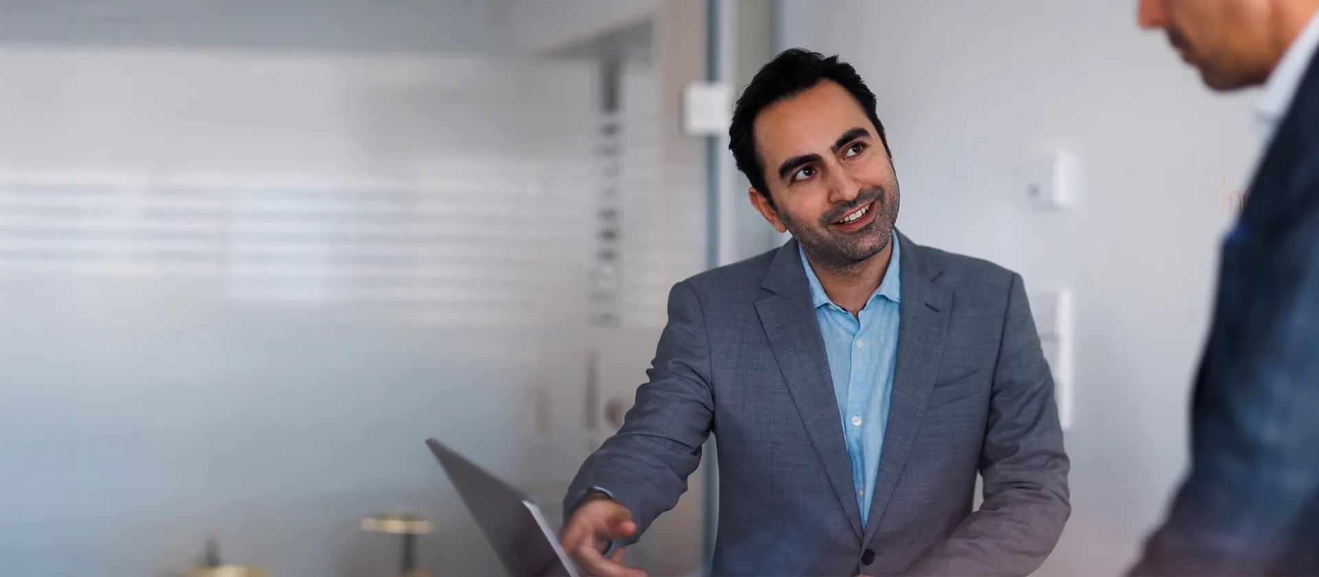 SAP consultant in a business meeting, discussing enterprise software solutions and digital transformation strategies in a modern office setting.